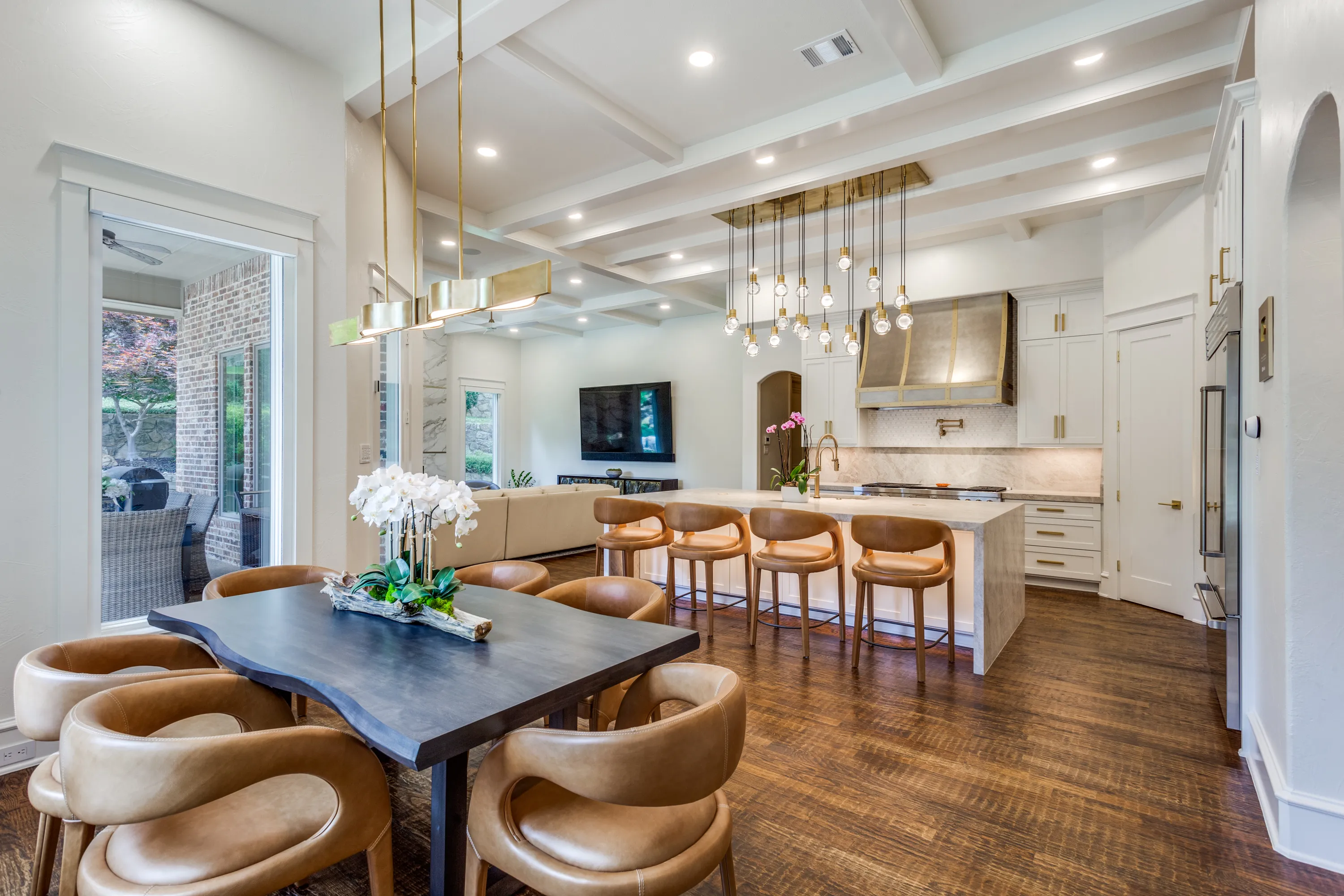 Live-edge dining table with kitchen island and family room beyond